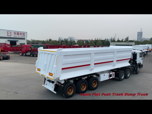 Flat push track dump truck departs